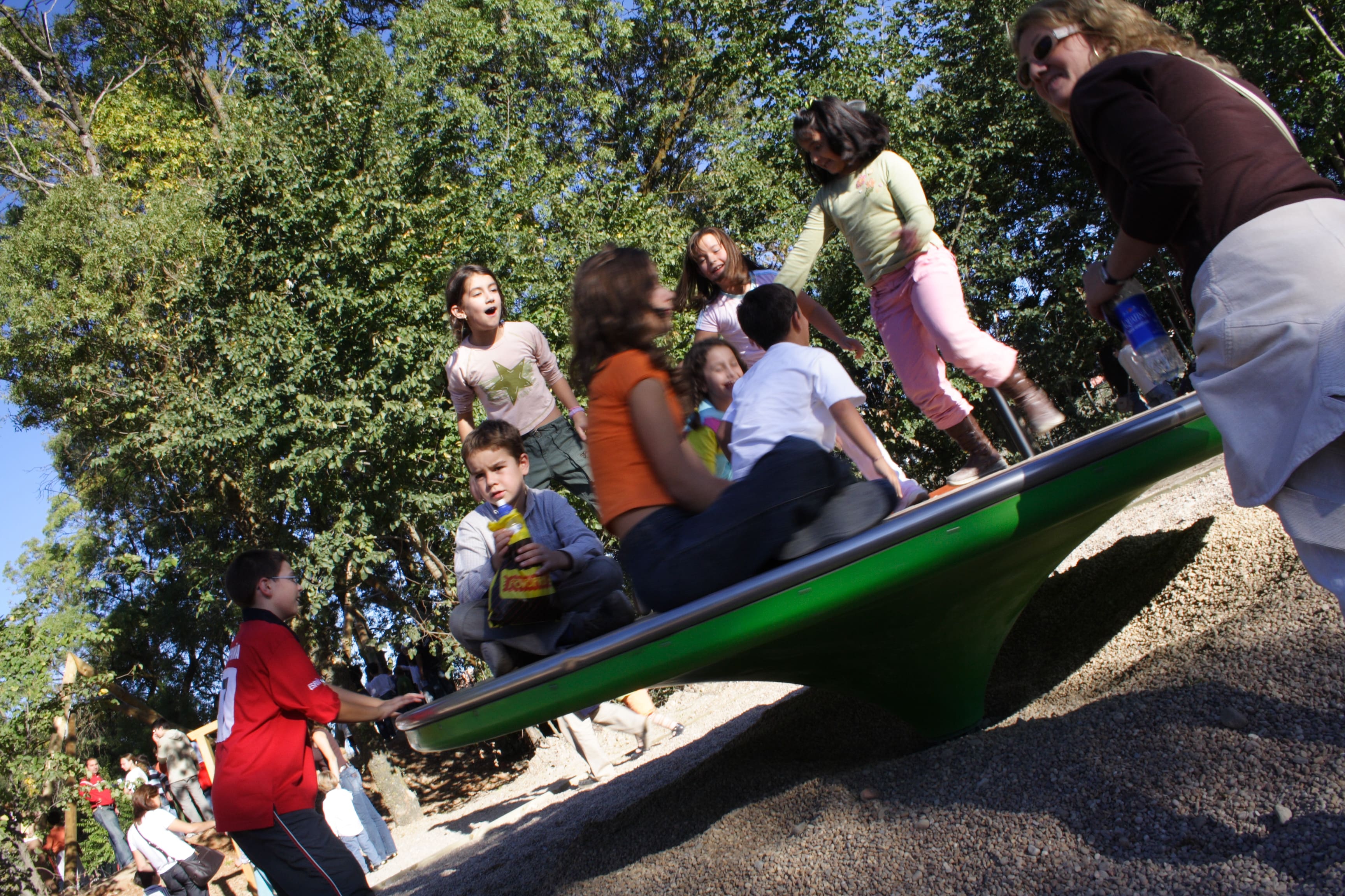 A playground roundabout natural alternative the Giant revolving disc is made from timber and great fun for all