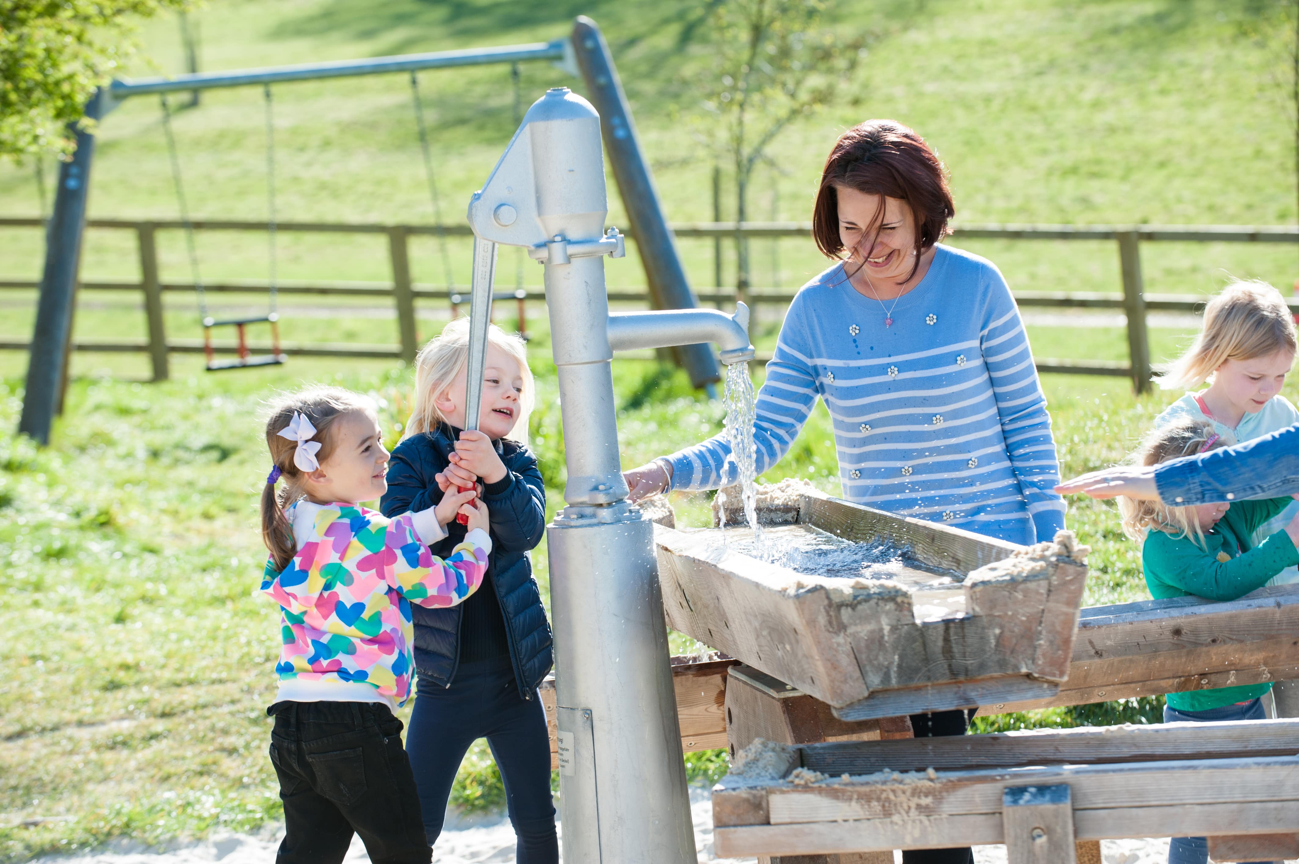 Water play inspired by a water pump